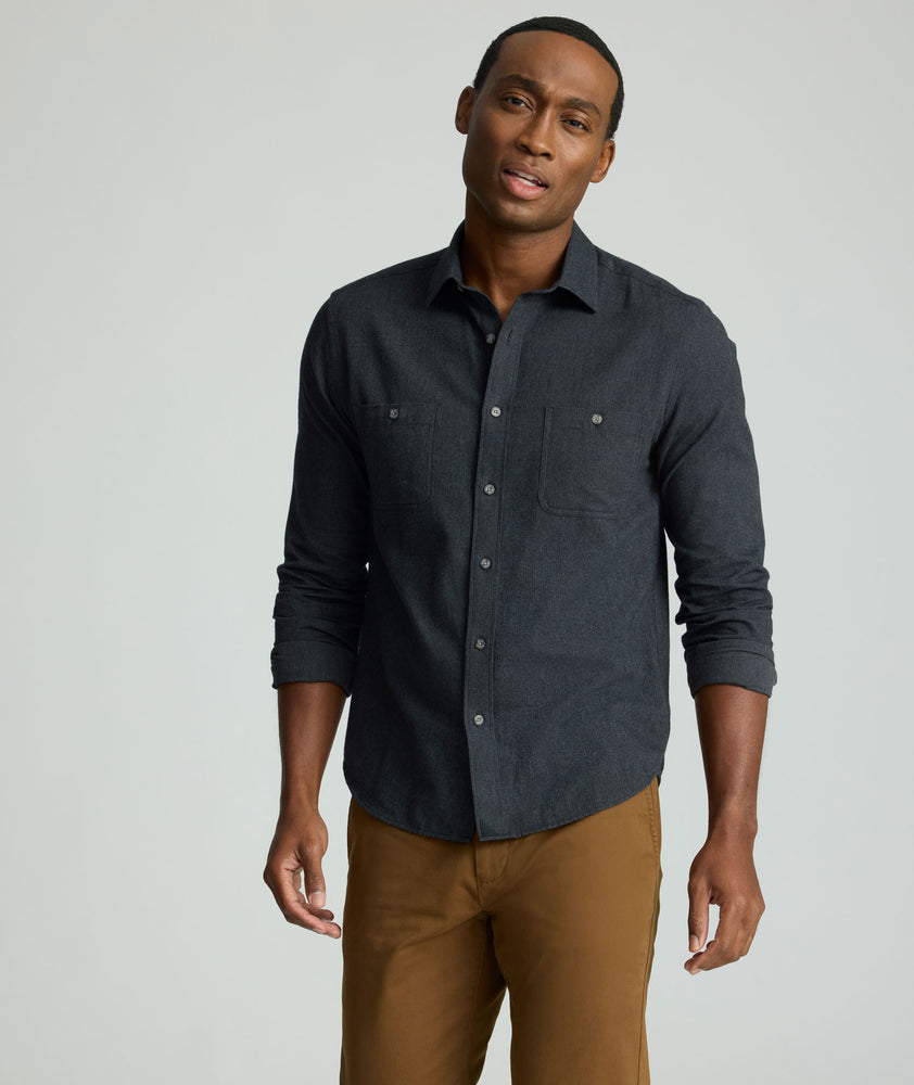 Model is wearing UNTUCKit Flannel Hemsworth Shirt in Deep Gray Herringbone.