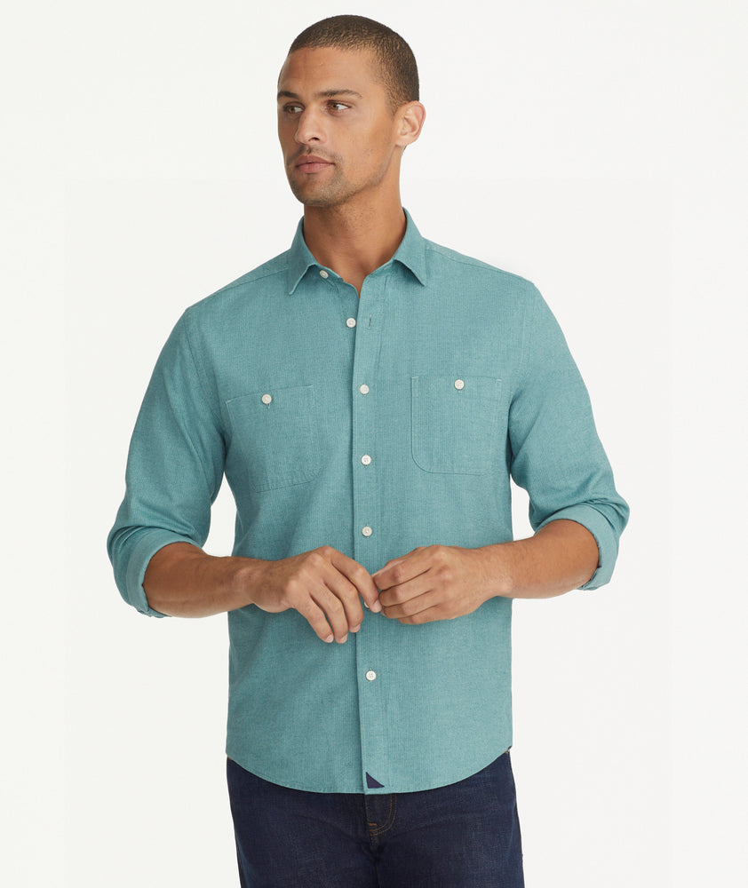 Model is wearing UNTUCKit Flannel Hemswoth Shirt in light green.