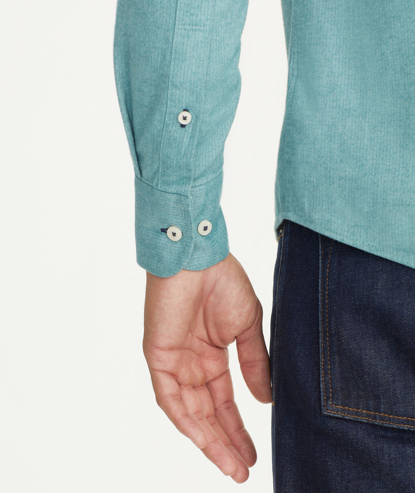 Model is wearing UNTUCKit Flannel Hemswoth Shirt in light green.