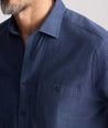Model is wearing UNTUCKit Flannel Hemsworth Shirt in Indigo.
