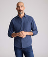 Model is wearing UNTUCKit Flannel Hemsworth Shirt in Indigo.