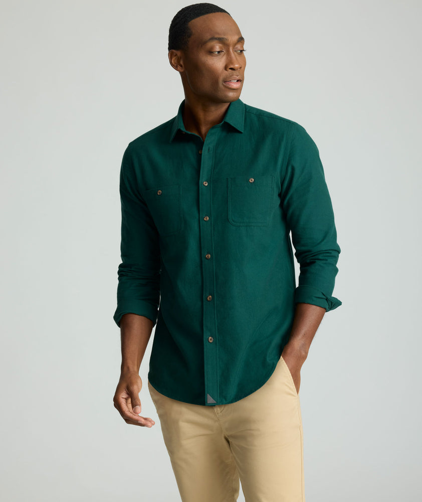 Model is wearing UNTUCKit Flannel Hemsworth Shirt in scarab. 