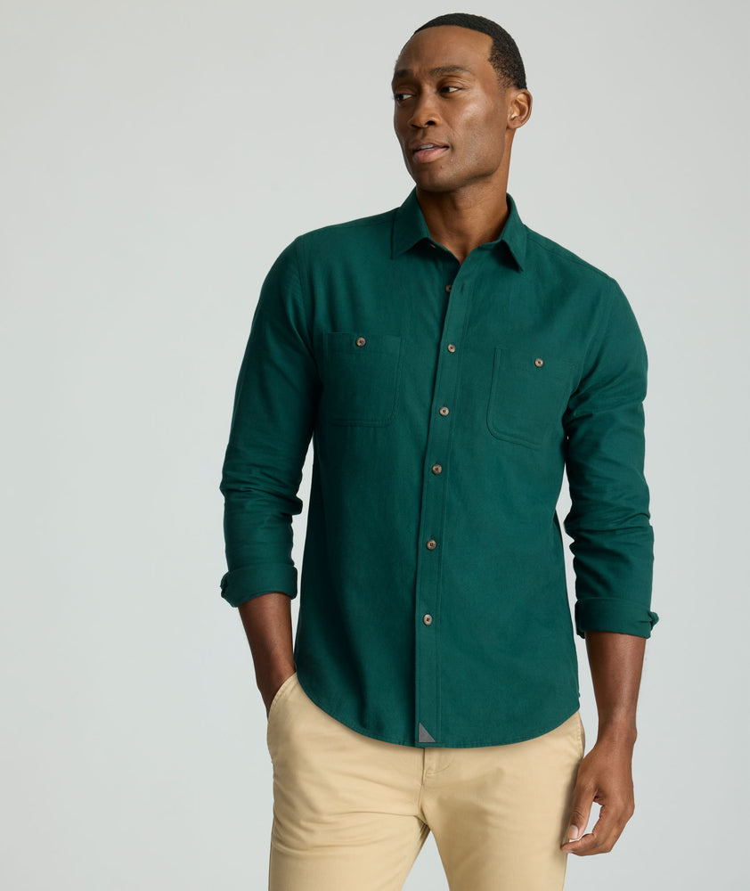 Model is wearing UNTUCKit Flannel Hemsworth Shirt in scarab. 