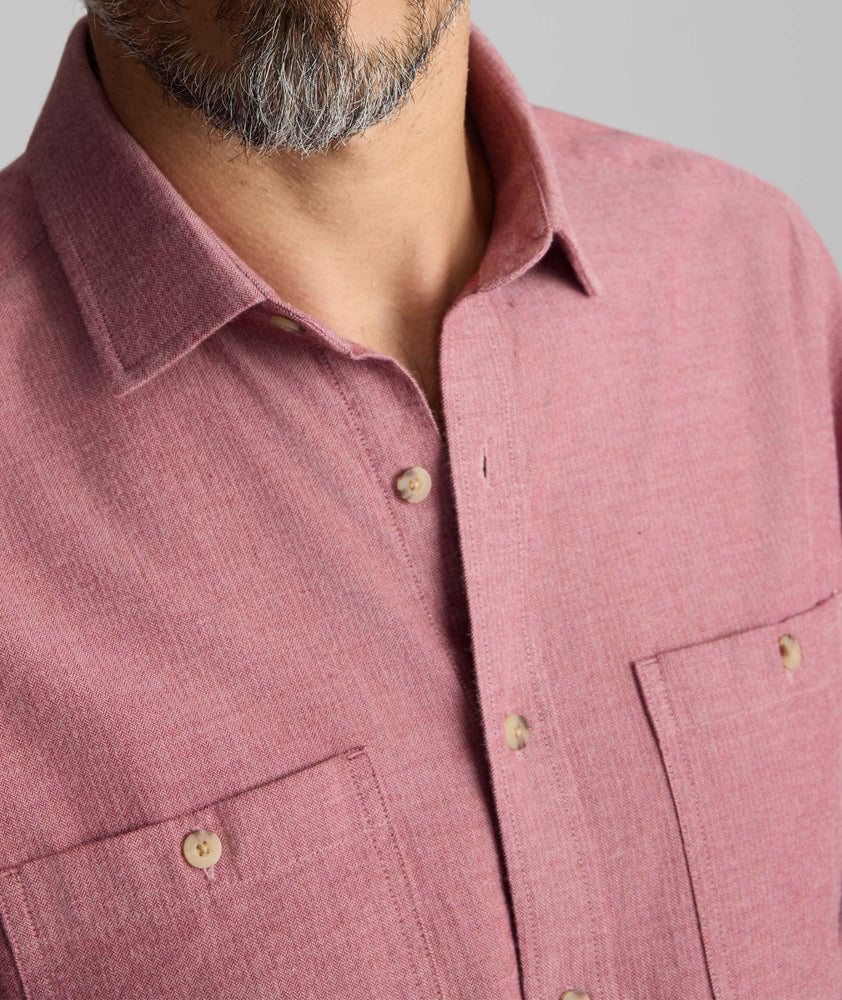 Model is wearing UNTUCKit Flannel Hemsworth Shirt in Red.