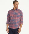 Model is wearing UNTUCKit Wrinkle-Free Performance Hendon Shirt in navy plaid.