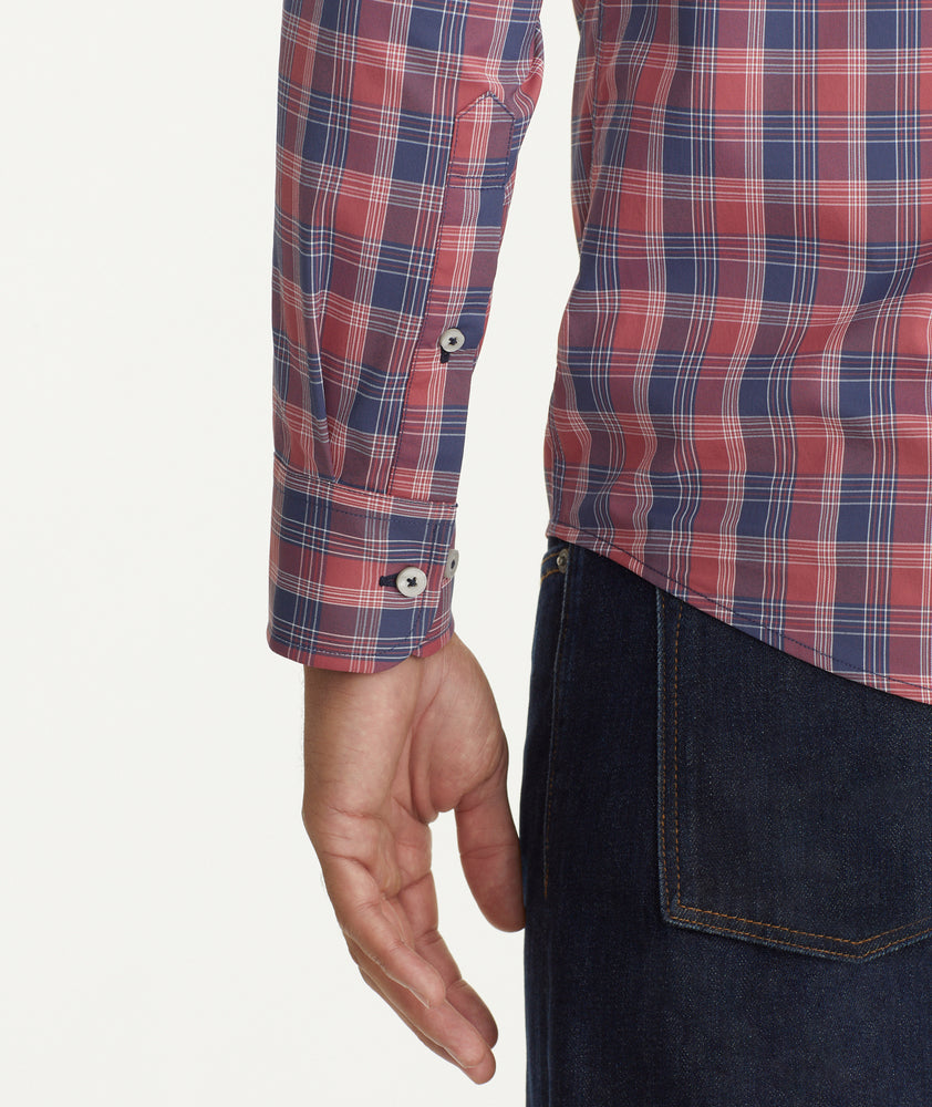 Model is wearing UNTUCKit Wrinkle-Free Performance Hendon Shirt in navy plaid.