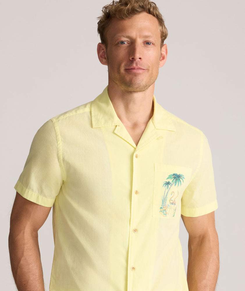 Model is wearing UNTUCKit Vintage Wash Short-Sleeve Camp Collar Shirt. 