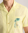 Model is wearing UNTUCKit Vintage Wash Short-Sleeve Camp Collar Shirt. 