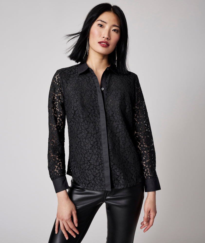 Model is wearing UNTUCKit Holly shirt in black.
