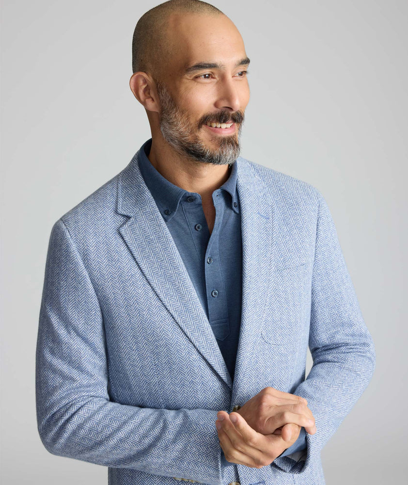 Model wearing a blue sport coat.