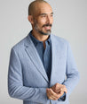 Model wearing a blue sport coat.