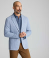 Model wearing a blue sport coat.