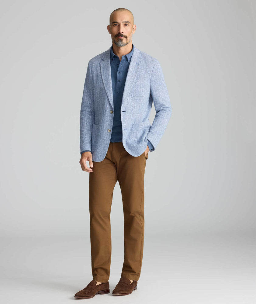 Model wearing a blue sport coat.