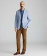 Model wearing a blue sport coat.
