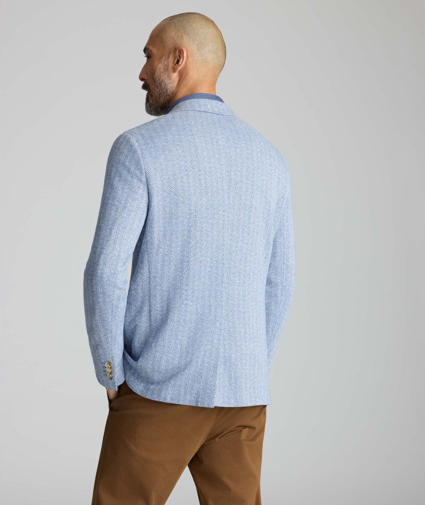 Model wearing a blue sport coat.