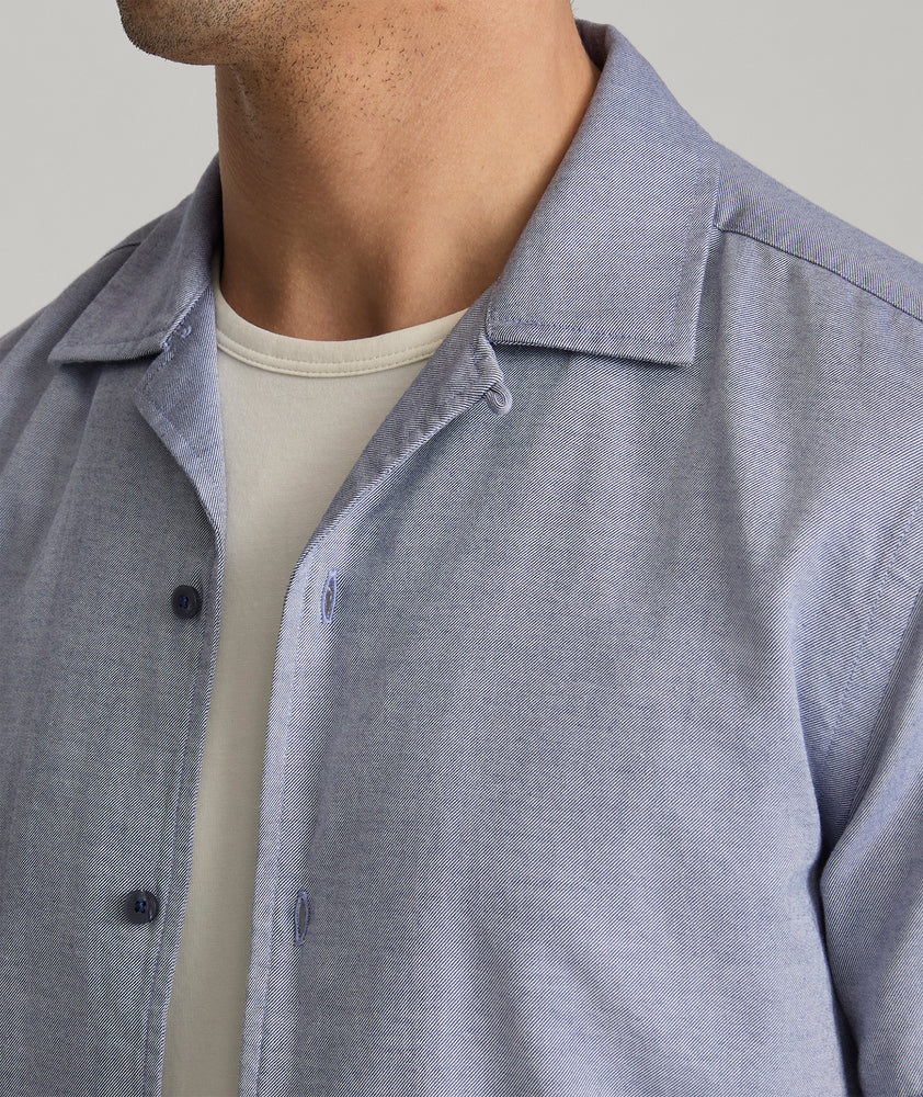 Model is wearing UNTUCKit Hughes in dark blue. 