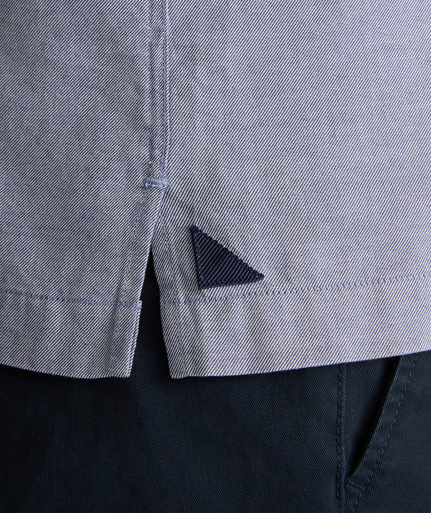 Model is wearing UNTUCKit Hughes in dark blue. 