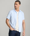 Model is wearing UNTUCKit Hughes in light blue. 
