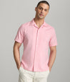 Model is wearing UNTUCKit Hughes in light red. 