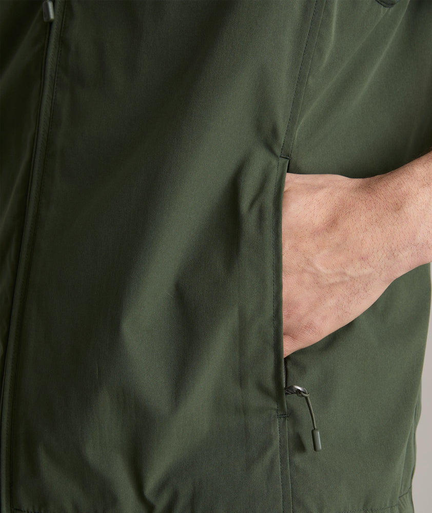 Model is wearing UNTUCKit Inman performance vest in green.