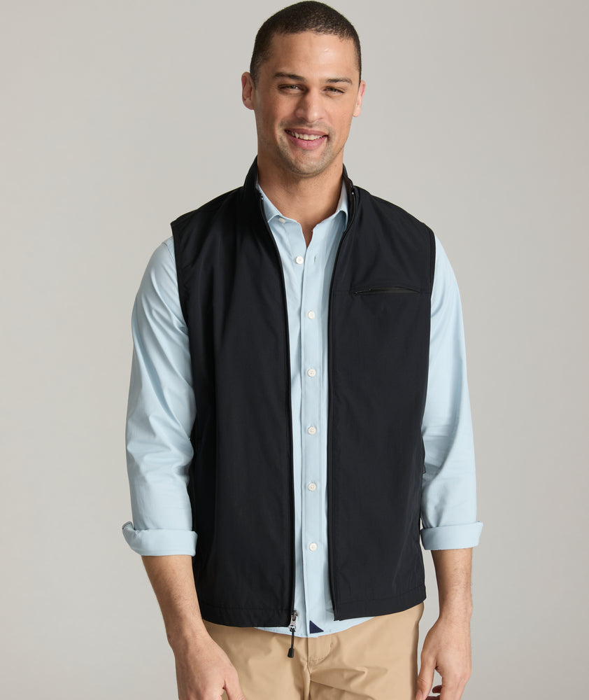 Model is wearing UNTUCKit inman vest in black.