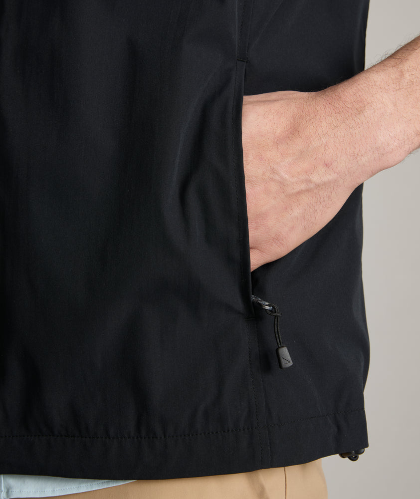 Model is wearing UNTUCKit inman vest in black.