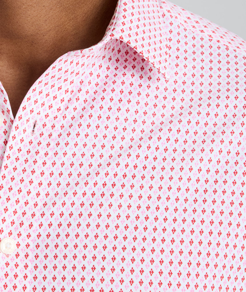 Model is wearing UNTUCKit Ireton short sleeve performance shirt in red. 
