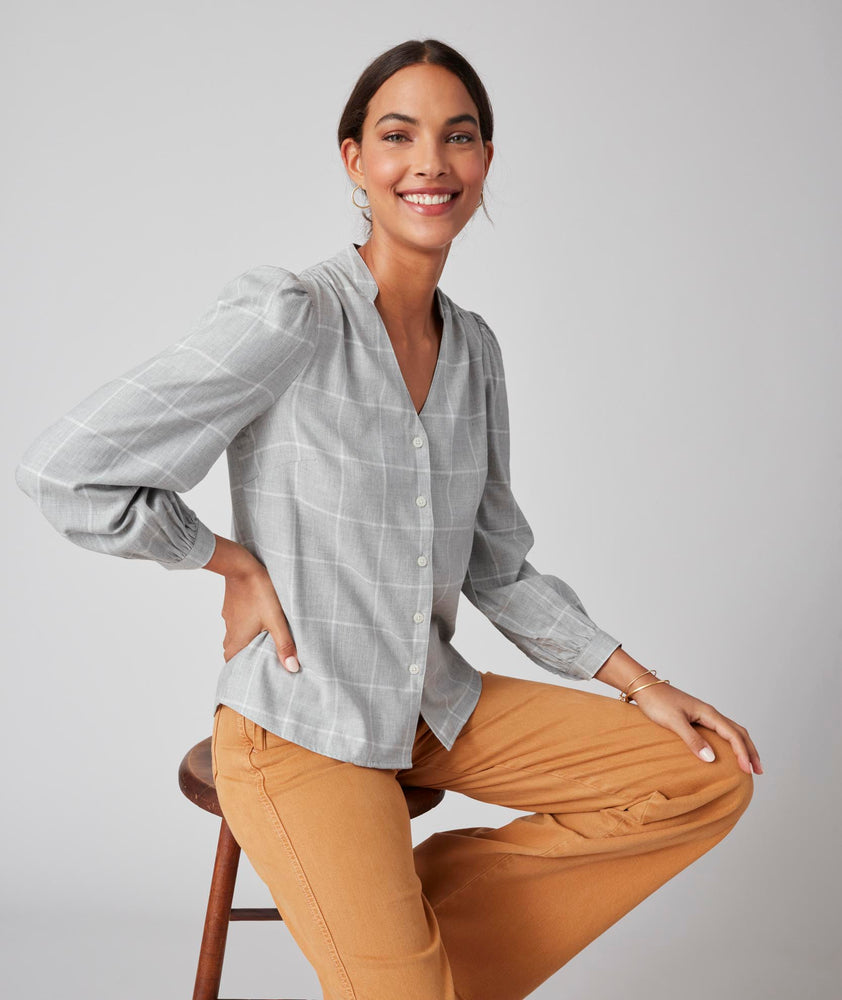 Model is wearing UNTUCKit Iris shirt in plaid grey.