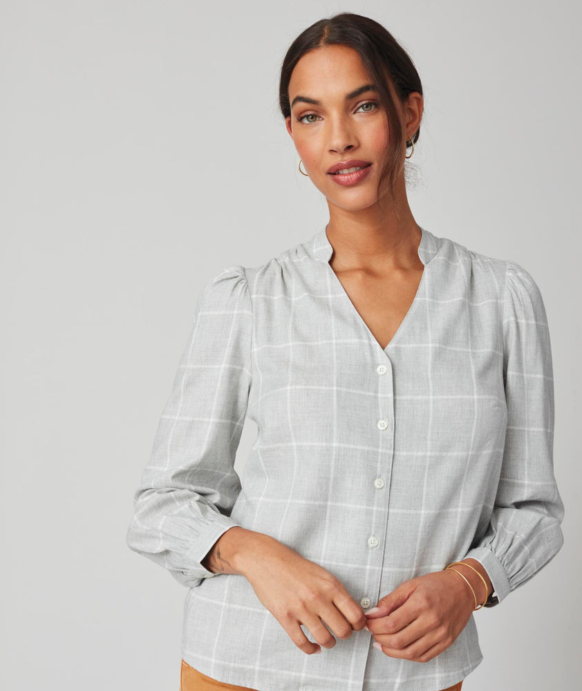 Model is wearing UNTUCKit Iris shirt in plaid grey.