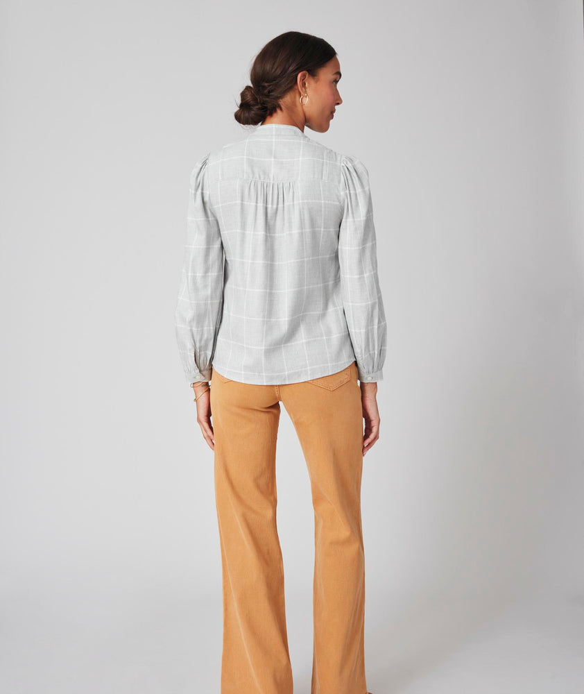 Model is wearing UNTUCKit Iris shirt in plaid grey.