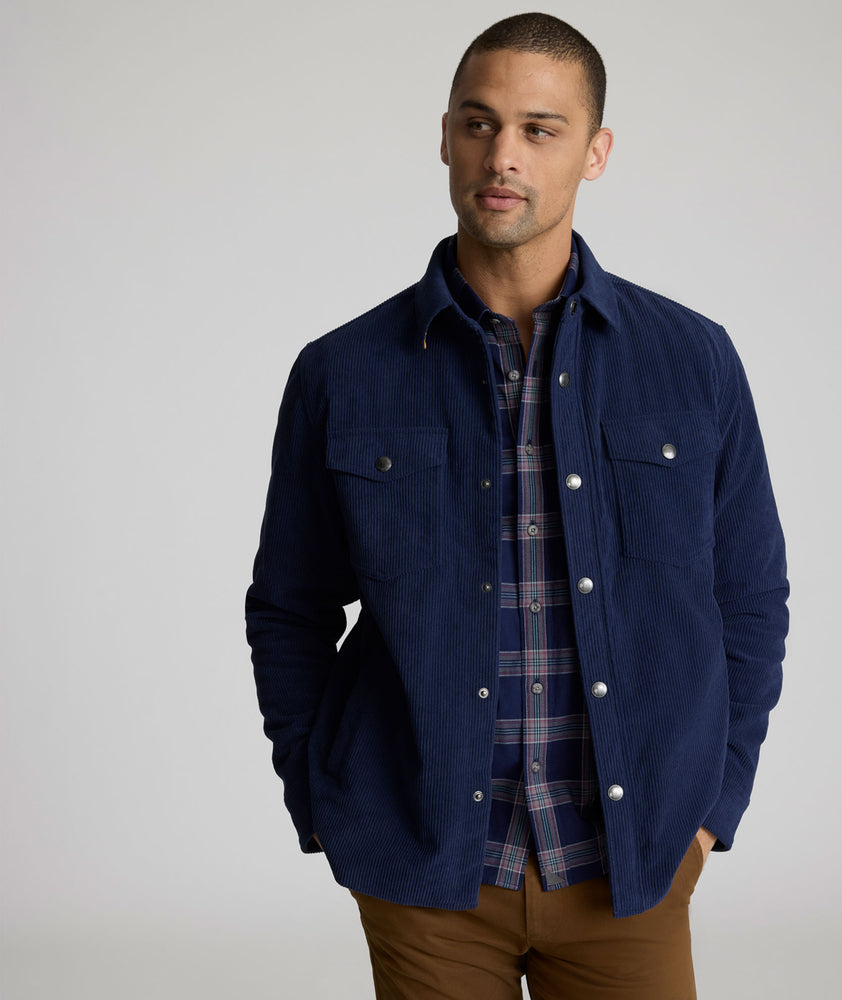 Model is wearing UNTUCKit Irvine coat in peacoat.