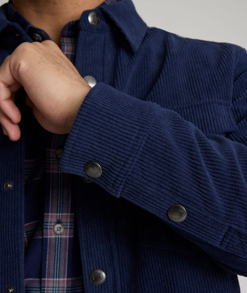 Model is wearing UNTUCKit Irvine coat in peacoat.