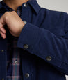 Model is wearing UNTUCKit Irvine coat in peacoat.