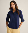 Model is wearing Isabella shirt in Navy. 