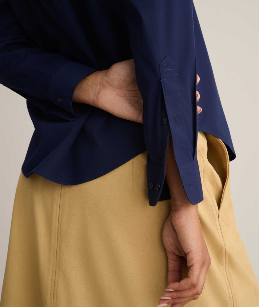 Model is wearing Isabella shirt in Navy. 