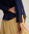 Model is wearing Isabella shirt in Navy. 