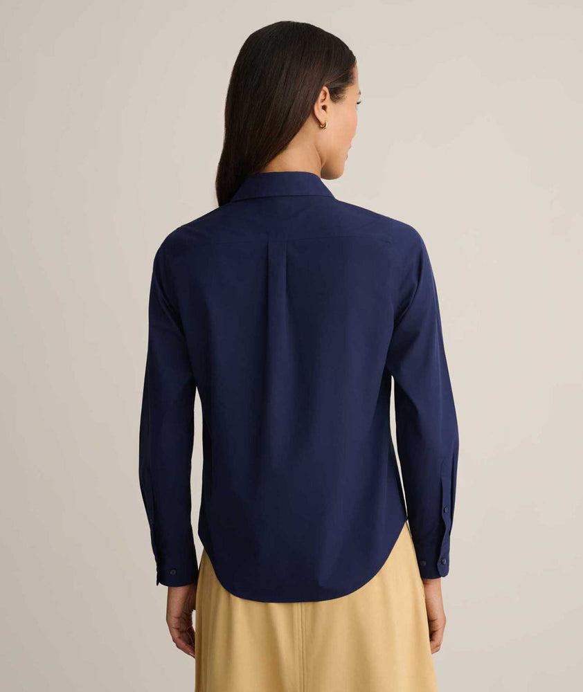 Model is wearing Isabella shirt in Navy. 