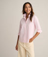 Model is wearing UNTUCKit Isabella shirt in pink. 
