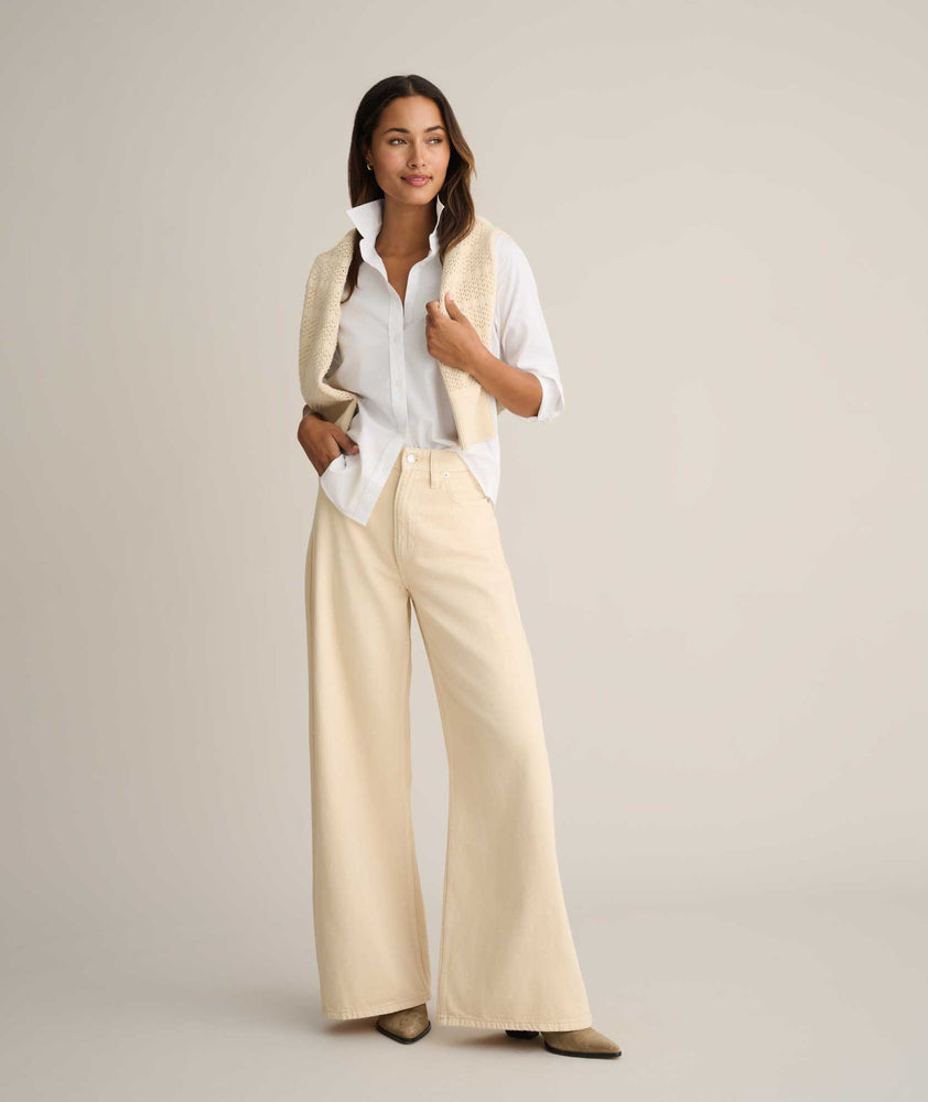 Model is wearing UNTUCKit Isabella shit in white. 