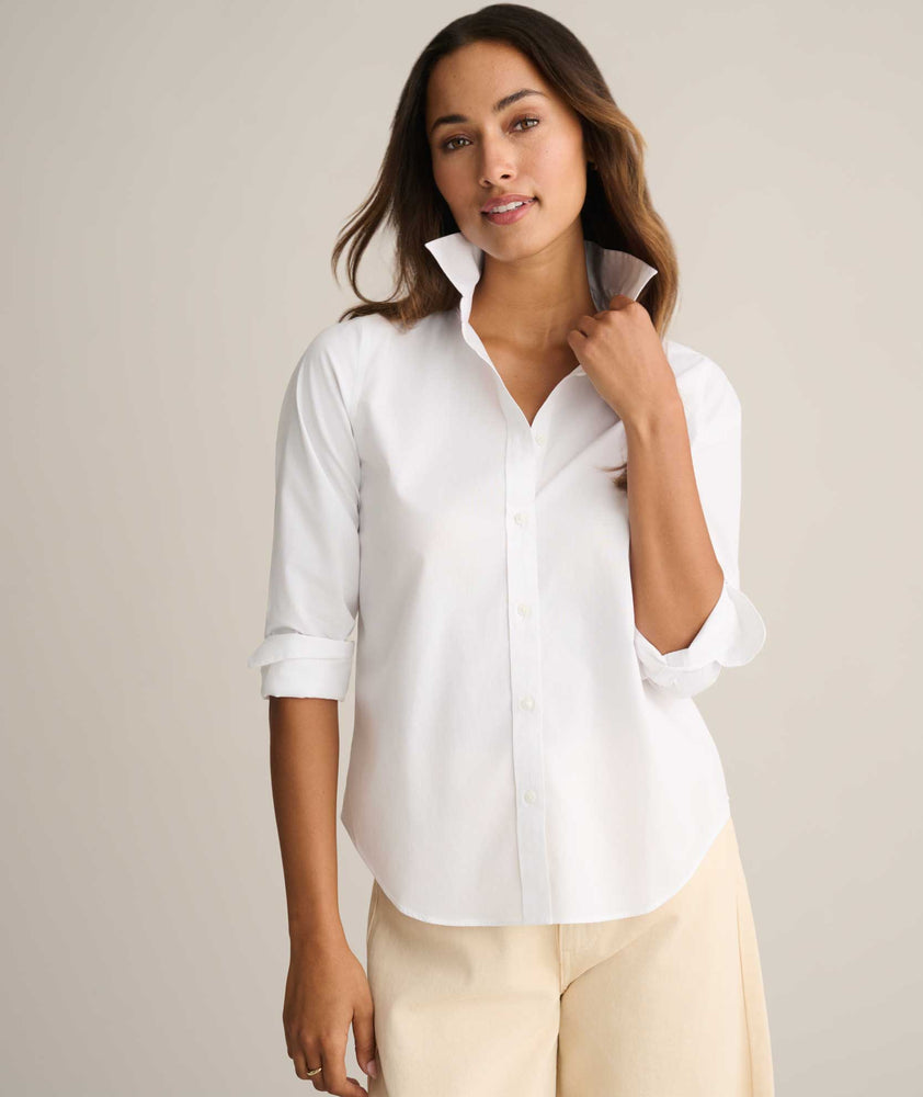 Model is wearing UNTUCKit Isabella shit in white. 