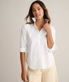 Model is wearing UNTUCKit Isabella shit in white. 