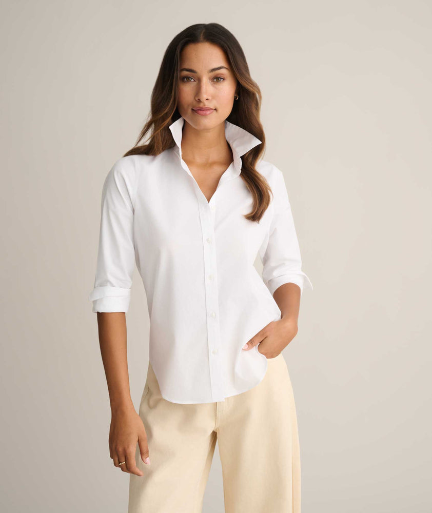 Model is wearing UNTUCKit Isabella shit in white. 