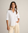 Model is wearing UNTUCKit Isabella shit in white. 