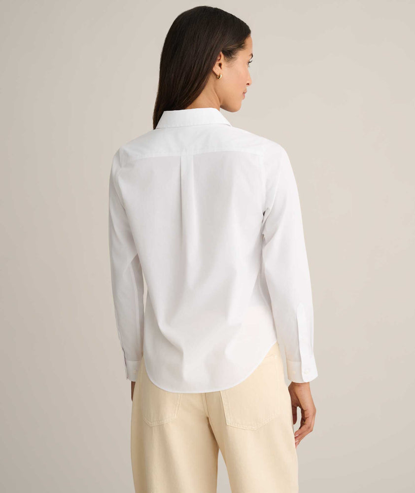 Model is wearing UNTUCKit Isabella shit in white. 