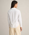 Model is wearing UNTUCKit Isabella shit in white. 