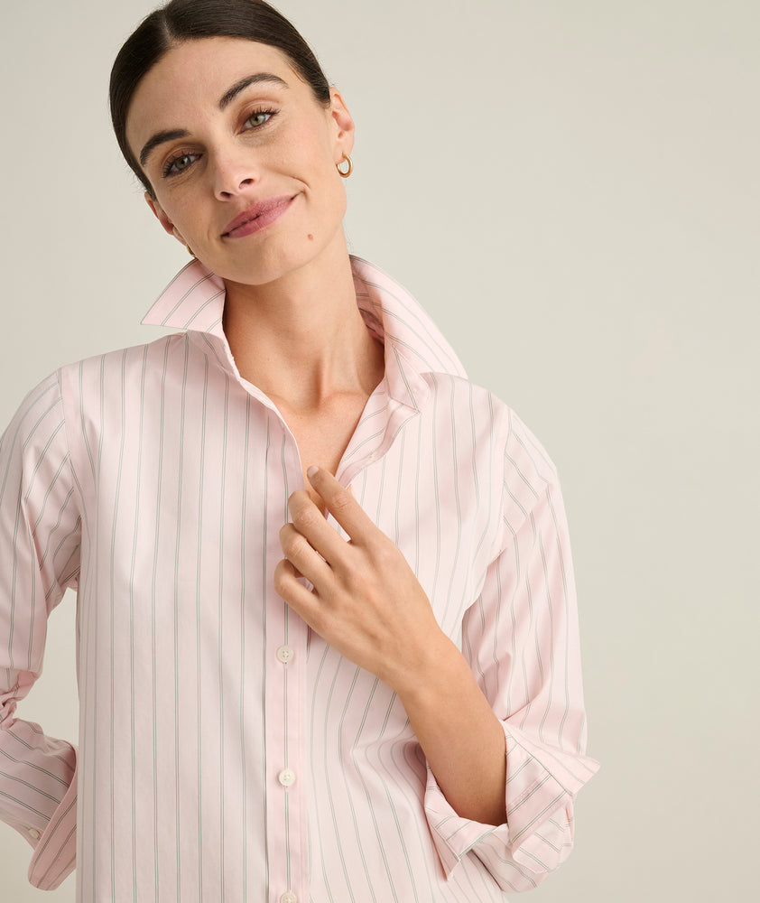 Model is wearing UNTUCKit Isabella pink stripped shit. 