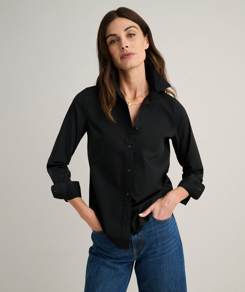 Model is wearing UNTUCKit Isabella shirt in black. 