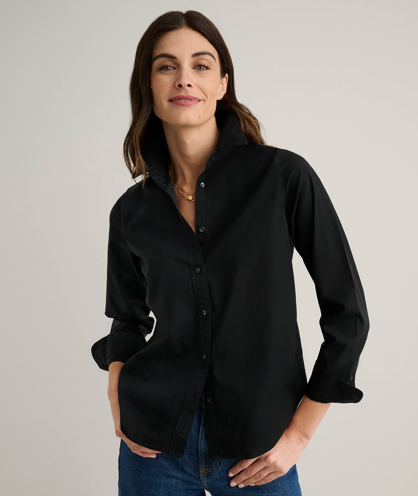 Model is wearing UNTUCKit Isabella shirt in black. 