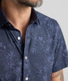 Model is wearing UNTUCKit Performance Short-Sleeve Islington Shirt.