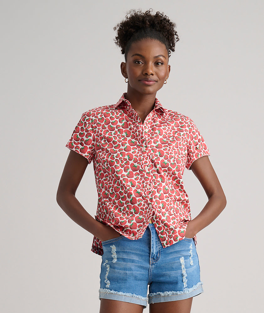 Model is wearing UNTUCKit Jamie shirt in strawberry print. 